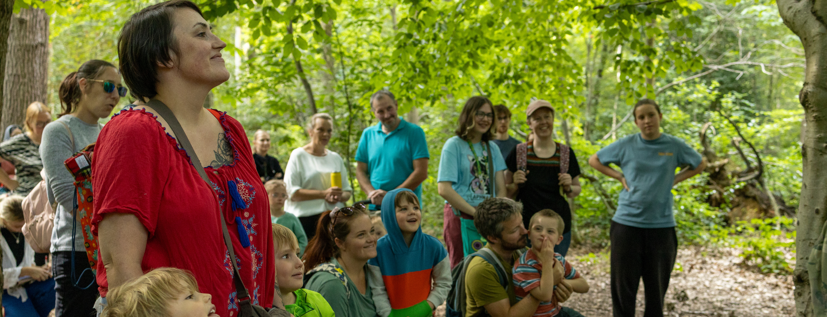 Families gather in the forest for 'A Future for All' event.